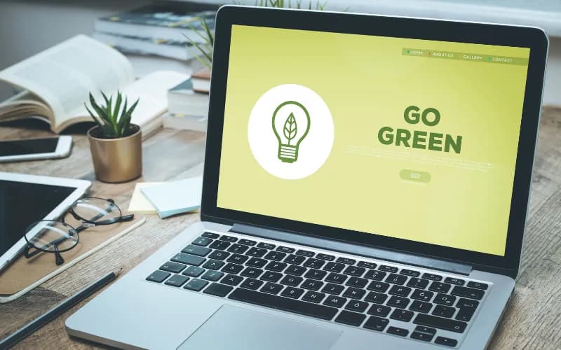 Laptop with screen saying Go Green