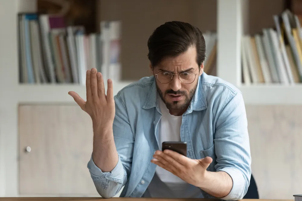 Man frustrated with his Android cell phone