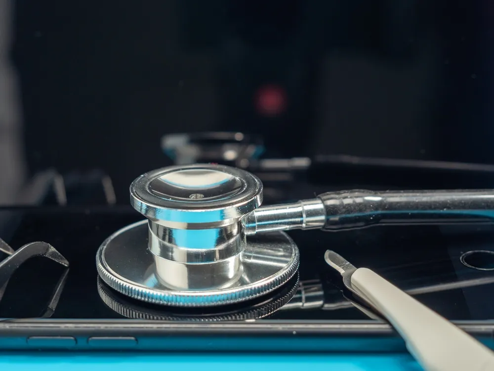 stethoscope sitting on a mobile phone