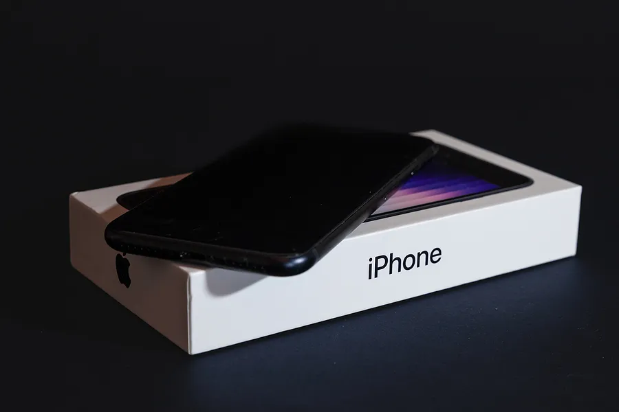iPhone sitting on its box