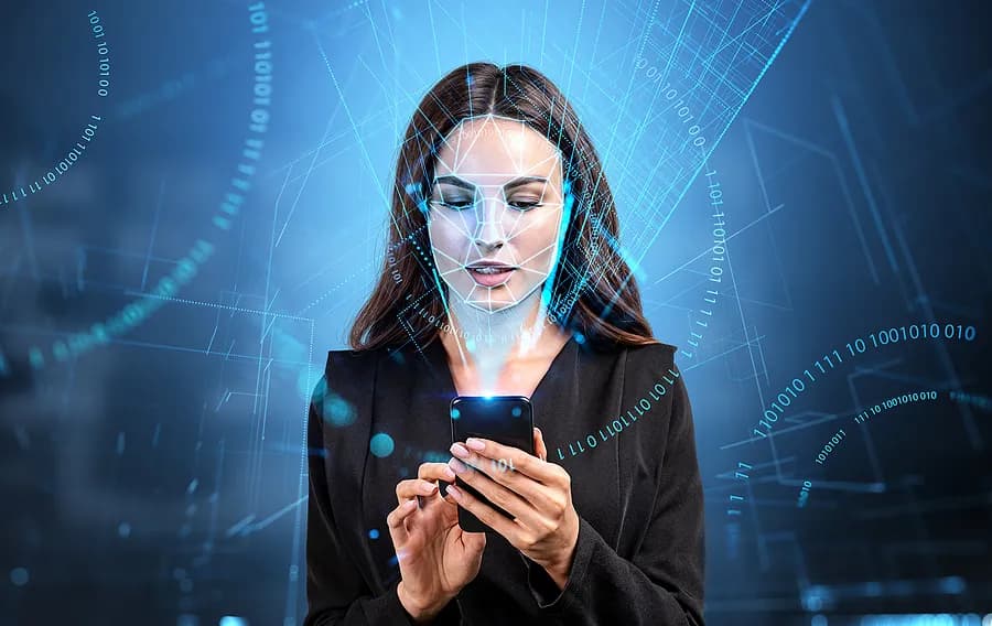 Women holding her mobile phone on a blue background.