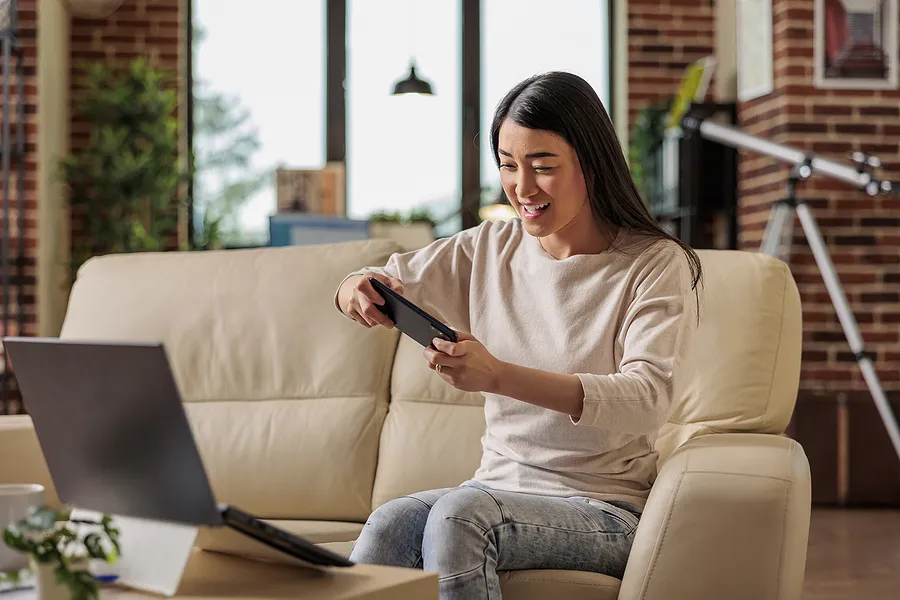 Woman playing games on her mobile phone.